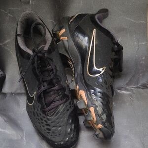 Black and Gold Nike Athletic Cleats
